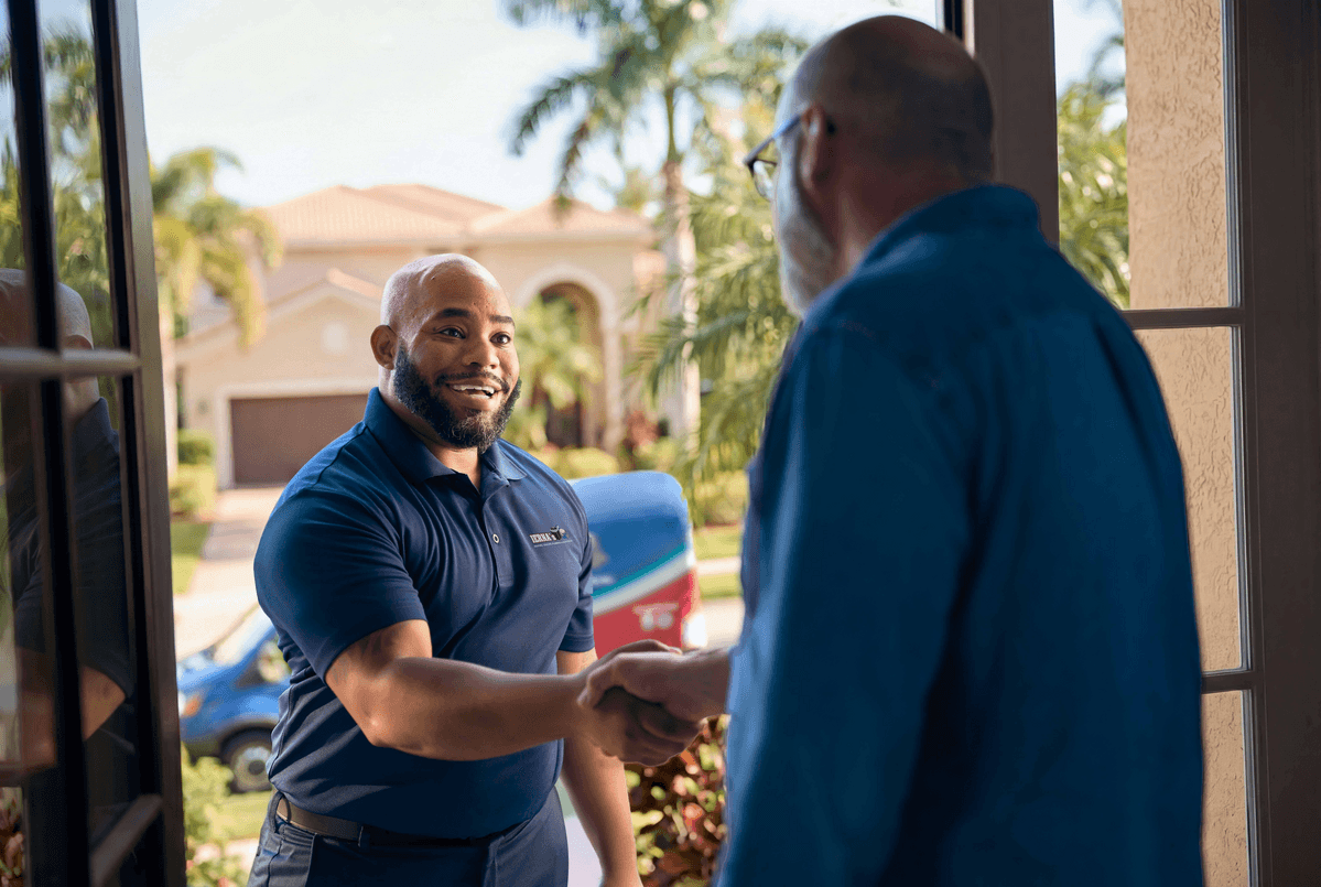 Technician shaking customers hand